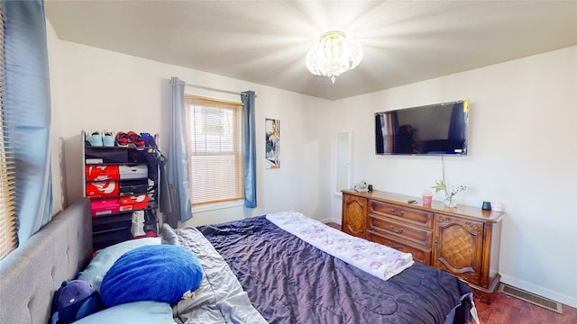 2809 Easton Blvd, Des Moines, IA 50317 - bedroom with wood finished floors and a chandelier