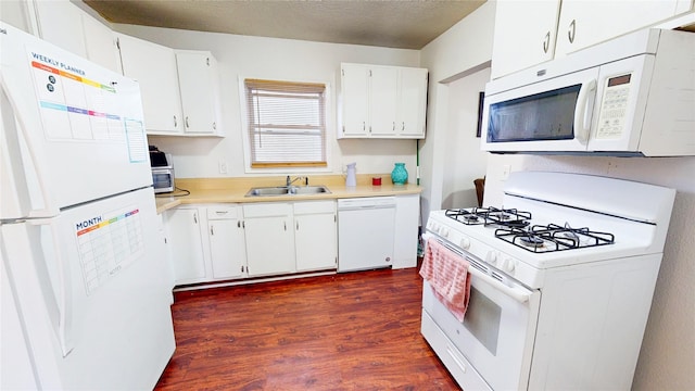 2809 Easton Blvd, Des Moines, IA 50317 - kitchen with white appliances, dark wood-style flooring, light countertops, and white cabinets