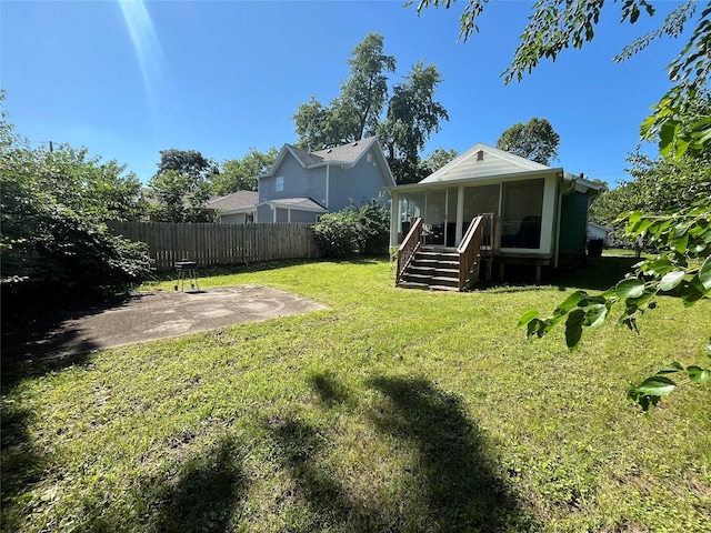 2809 Easton Blvd, Des Moines, IA 50317 - view of yard with a sunroom and a patio area