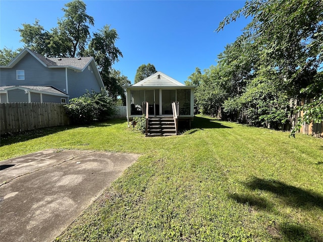 2809 Easton Blvd, Des Moines, IA 50317 - fenced backyard with a sunroom