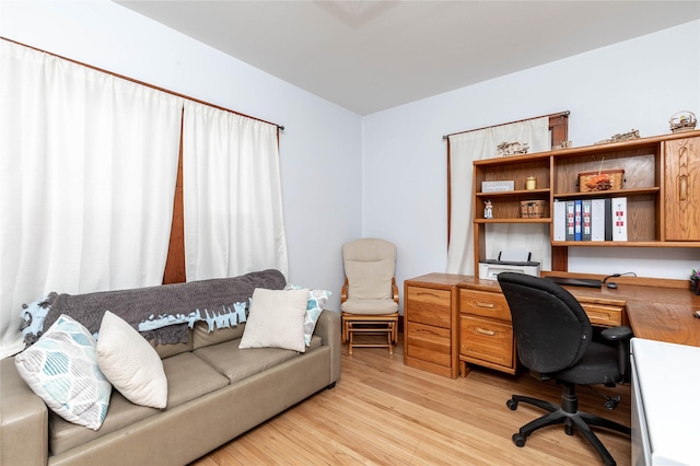 office space with light wood finished floors
