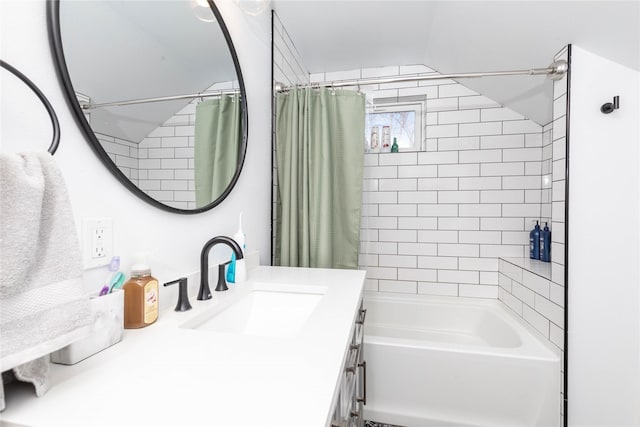 bathroom featuring shower / bath combo with shower curtain and vanity