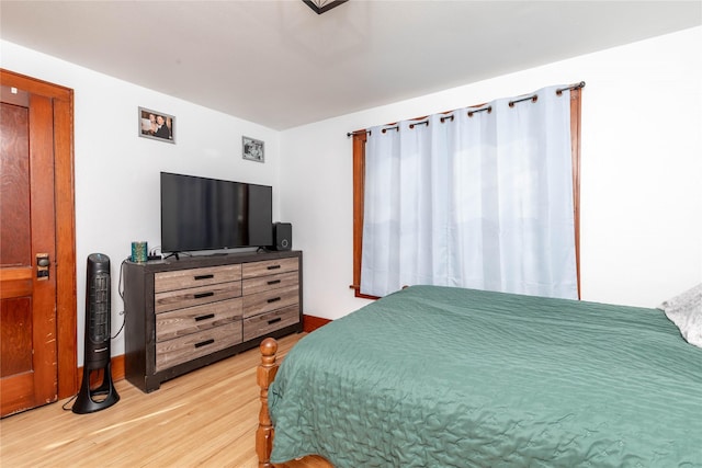 bedroom featuring light wood-style floors