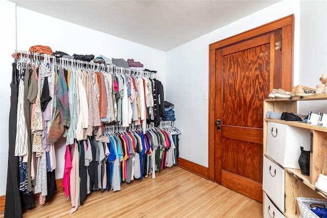 spacious closet with wood finished floors