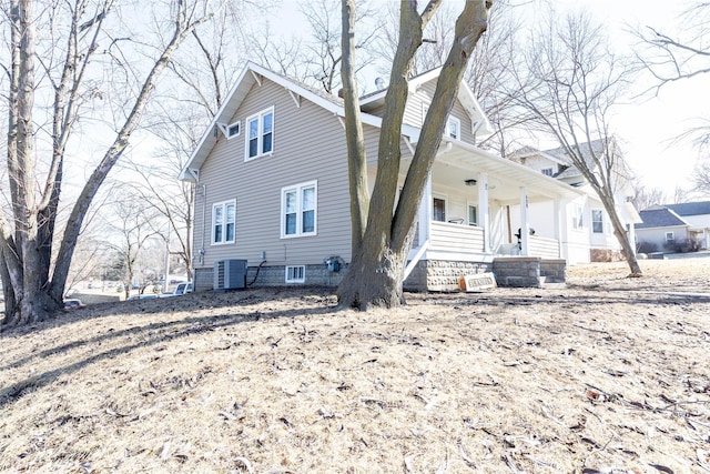 exterior space featuring a porch and cooling unit
