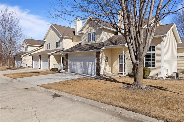 view of front of house featuring a garage, a residential view, central AC, and concrete driveway