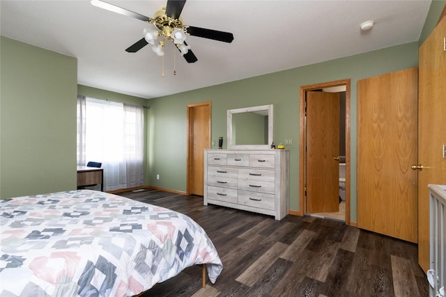 bedroom featuring a ceiling fan, baseboards, and wood finished floors