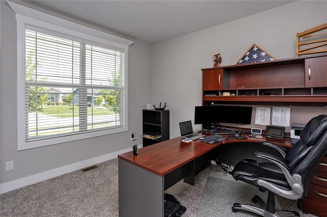 carpeted home office with baseboards and visible vents