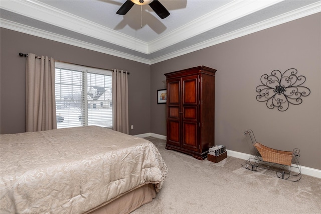 bedroom with baseboards, ornamental molding, a ceiling fan, and light colored carpet