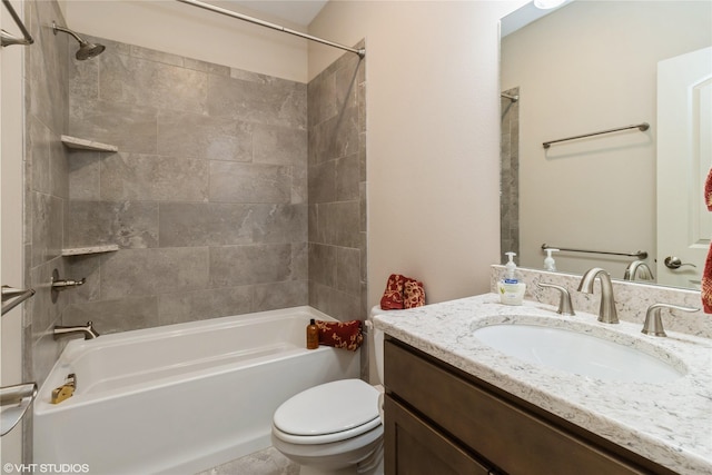 bathroom featuring bathing tub / shower combination, vanity, and toilet