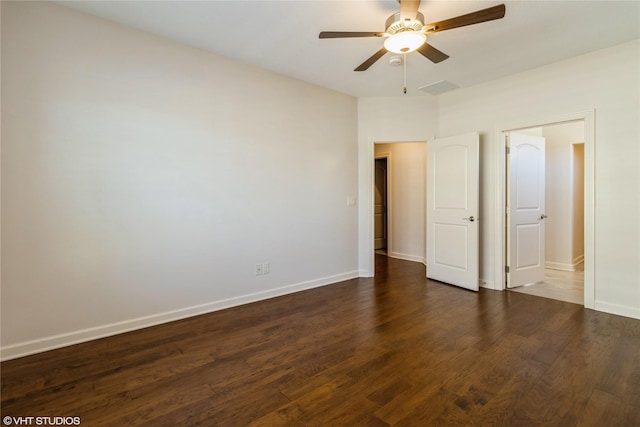 unfurnished bedroom with ceiling fan, baseboards, and wood finished floors