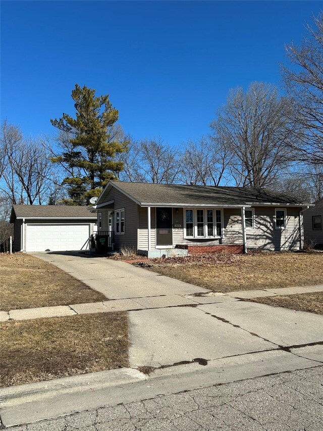 ranch-style house with covered porch and an outbuilding