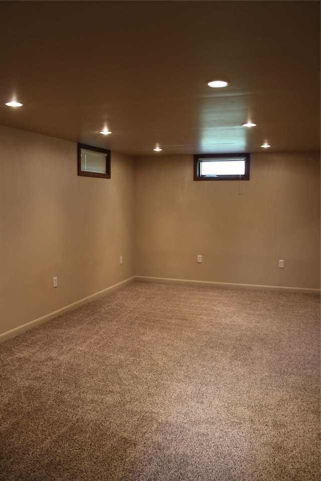 basement with baseboards, carpet floors, and recessed lighting