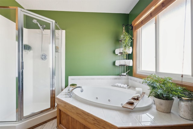 365 Williamson Ct, Pleasant Hill, IA 50327 - bathroom featuring a whirlpool tub and a stall shower