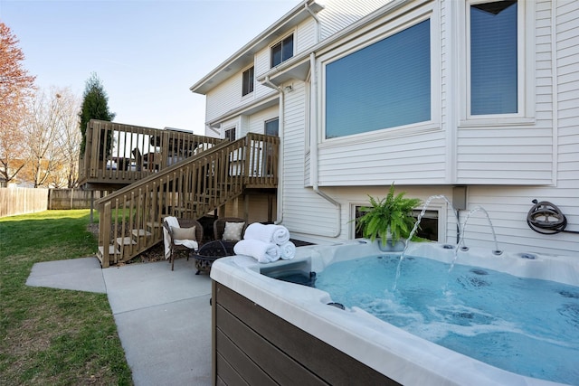 365 Williamson Ct, Pleasant Hill, IA 50327 - exterior space with stairway, fence, a yard, a wooden deck, and a hot tub