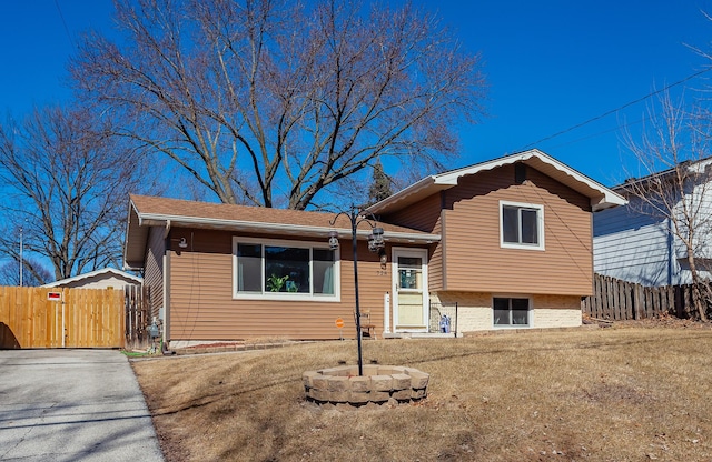 view of front of house with fence and a gate