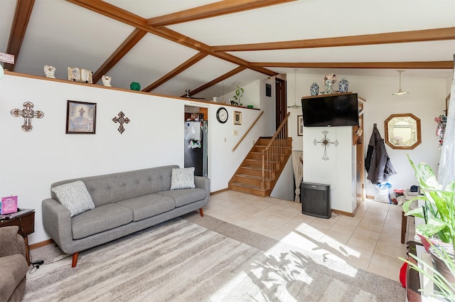 living area with stairs, light tile patterned flooring, and lofted ceiling