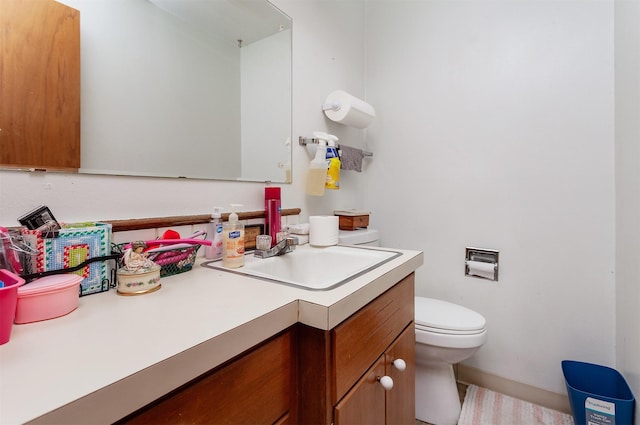 half bath with toilet and vanity