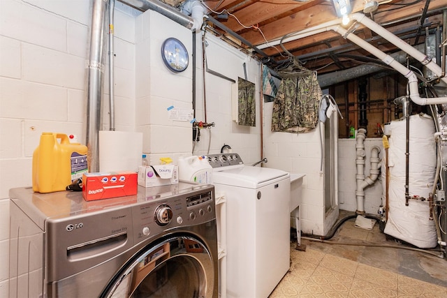 washroom featuring washer and dryer and laundry area