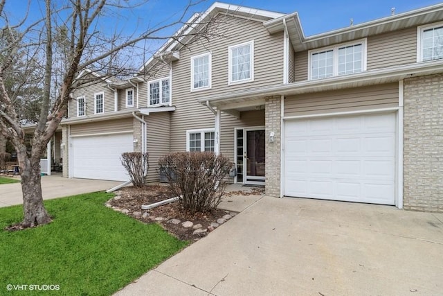 traditional-style house with an attached garage and concrete driveway