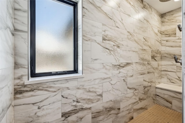 full bath featuring tiled shower