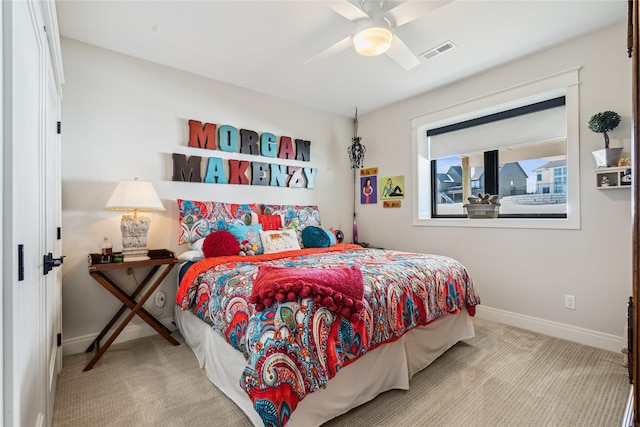 bedroom with a ceiling fan, carpet, visible vents, and baseboards