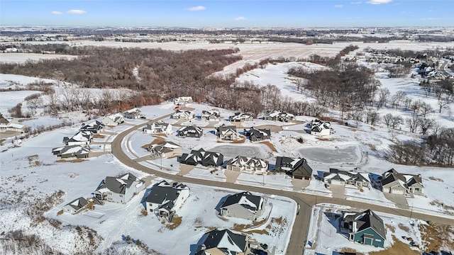 snowy aerial view featuring a residential view