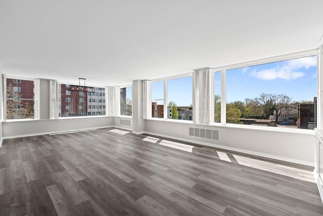 unfurnished sunroom with visible vents