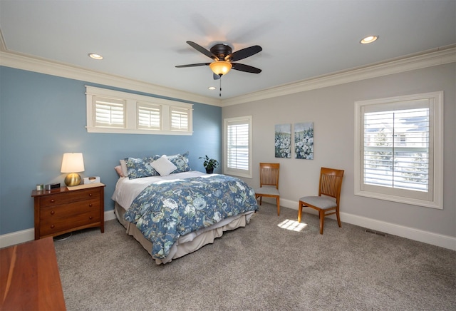 bedroom featuring ornamental molding, carpet flooring, visible vents, and baseboards