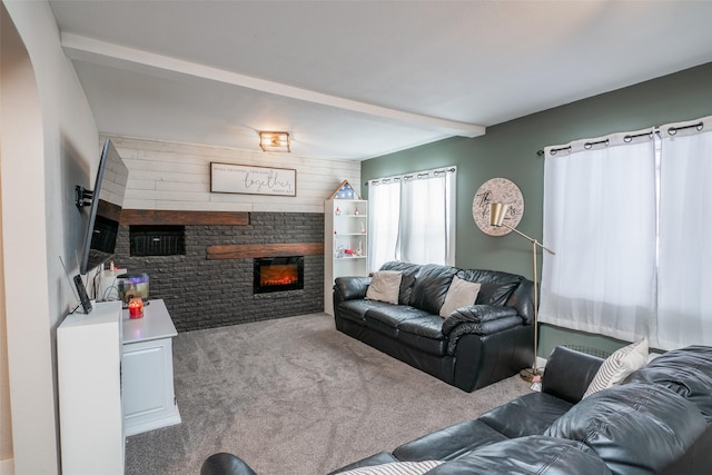 living area featuring beamed ceiling, carpet, and a fireplace