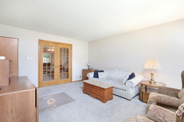 living room featuring french doors and light colored carpet