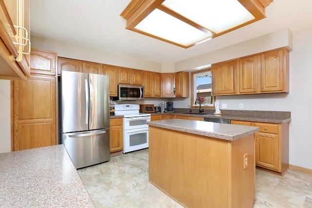 kitchen featuring a center island, a sink, and stainless steel appliances