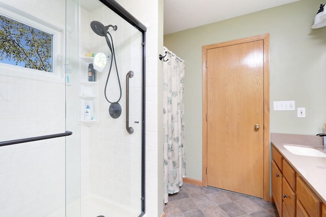 bathroom with vanity and a stall shower