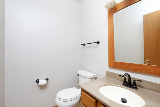 half bath with vanity and toilet