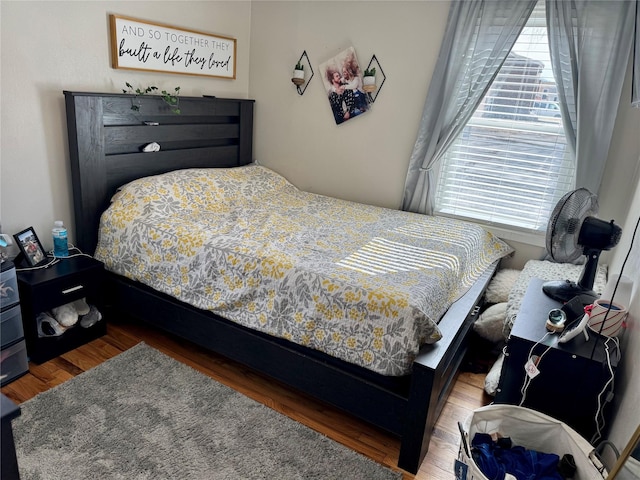 bedroom featuring wood finished floors