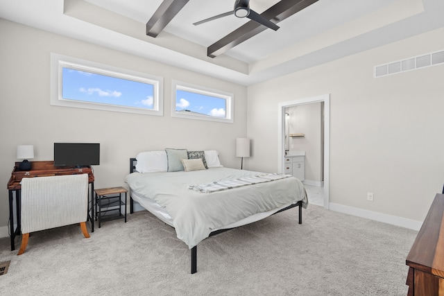 carpeted bedroom with ceiling fan, ensuite bathroom, visible vents, baseboards, and beam ceiling