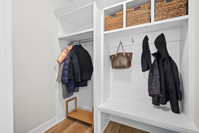 mudroom with wood finished floors and baseboards