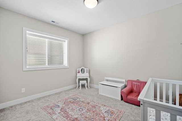 bedroom with carpet flooring, visible vents, and baseboards