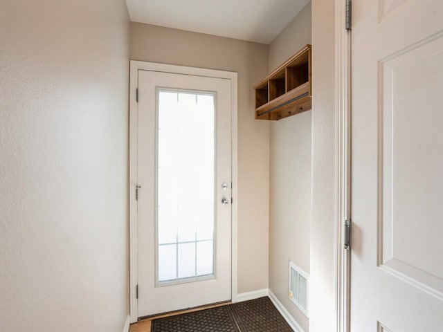 entryway with visible vents and baseboards