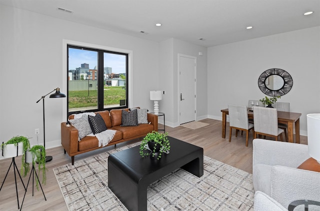 1160 Murphy St, Des Moines, IA 50309 - living area featuring light wood-style floors, baseboards, and recessed lighting