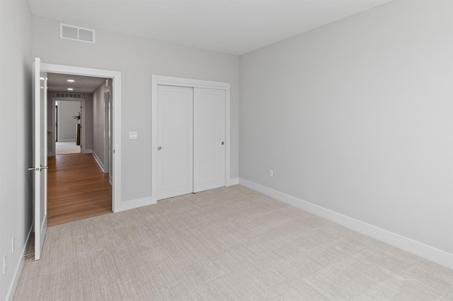 1160 Murphy St, Des Moines, IA 50309 - unfurnished bedroom with carpet, baseboards, and a closet