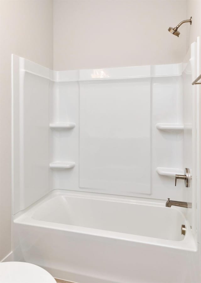 1160 Murphy St, Des Moines, IA 50309 - full bathroom featuring shower / washtub combination and toilet