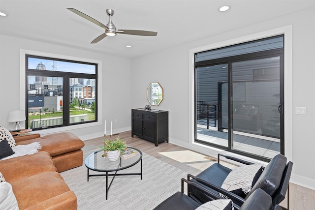 1160 Murphy St, Des Moines, IA 50309 - living area with light wood finished floors, ceiling fan, baseboards, and recessed lighting