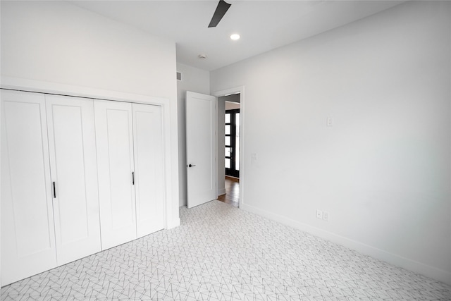 unfurnished bedroom with recessed lighting, carpet flooring, a ceiling fan, baseboards, and a closet