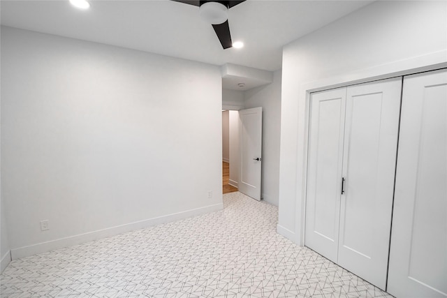 unfurnished bedroom with a closet, recessed lighting, a ceiling fan, and baseboards