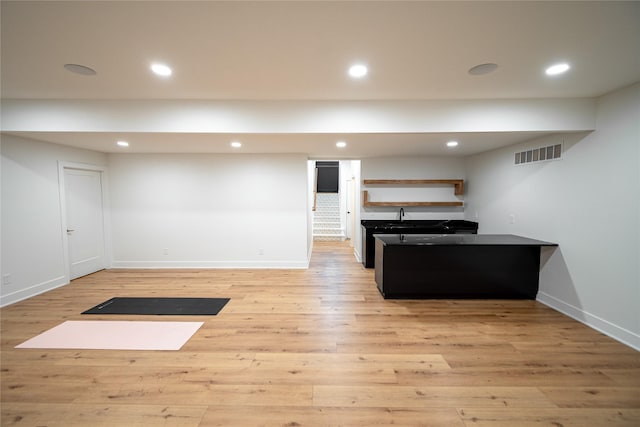 interior space featuring light wood-type flooring, visible vents, and recessed lighting