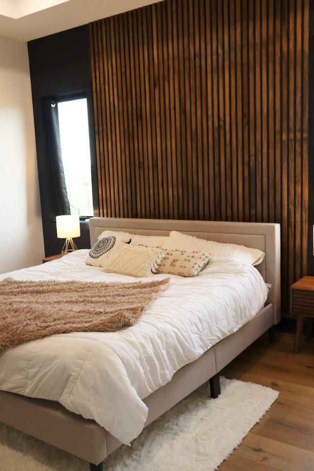 bedroom featuring wood finished floors