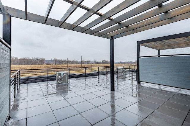 view of patio / terrace featuring a rural view and a pergola