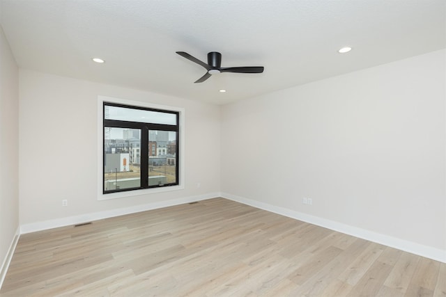 1166 Murphy St, Des Moines, IA 50309 - spare room featuring light wood-style flooring, ceiling fan, baseboards, and recessed lighting