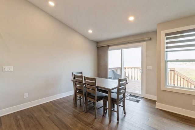 dining room with dark wood-type flooring, recessed lighting, and baseboards